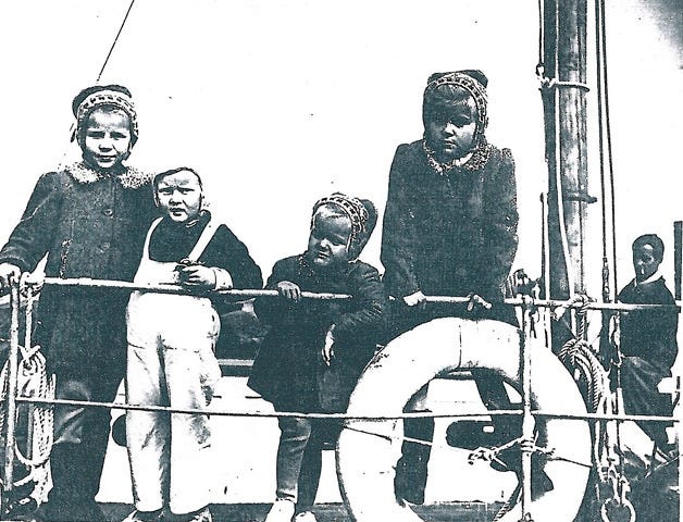 A boatload of refugees from Estonia bound for the U.S. after the end of World War II in 1945 included, from left, Aimi Kuun, who now lives in Flagler Beach, Yuta Paalberg, and Aimi's sisters Ulla Kuun and Inga Kuun, shown here aboard the Erma, a 36-foot sailboat formerly used to deliver mail. In the background is the three sisters' father, Arvid. PHOTO PROVIDED/AIMI KUUN