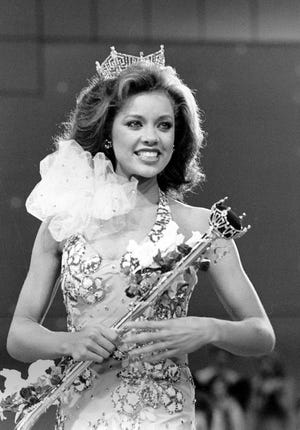 In this Sept. 17, 1983 file photo, Miss New York Vanessa Williams appears during her coronation walk after she was crowned Miss America 1984 at the Miss America Pageant in Atlantic City, N.J. The Miss America Organization, Dick Clark Productions and the ABC television network announced Tuesday, Sept. 8, 2015, that they are bringing back the actress and singer to serve as head judge for the 2016 competition. Williams won the title in 1984 but resigned after Penthouse magazine published sexually explicit photographs of her taken several years earlier. (AP Photo/Jack Kanthal, File)