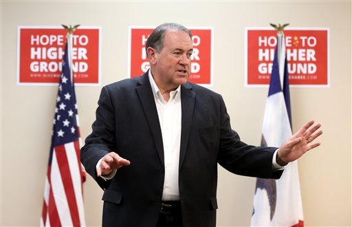 In this Tuesday, Aug. 11, 2015, file photo, GOP presidential candidate Mike Huckabee speaks during a campaign stop at the Maquoketa Public Library in Maquoketa, Iowa. Huckabee will join protesters Tuesday, Sept. 8, at a rally outside the jail where a Kentucky clerk is locked in a cell over her refusal to issue marriage licenses to gay couples. (Jessica Reilly/Telegraph Herald via AP)