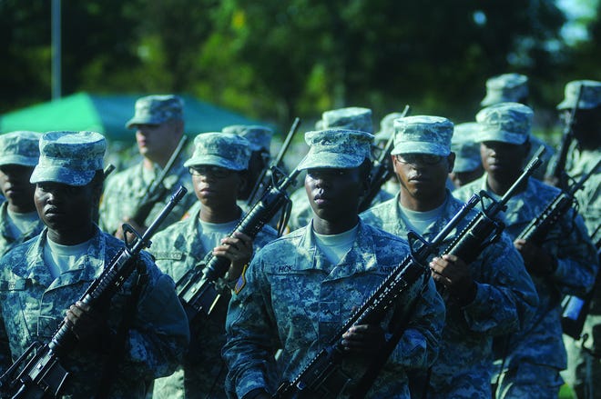 Soldiers from Bravo Company, 244th Quartermaster Battalion, stand in formation during the regulation portion of the 23rd Quartermaster Brigade Drill and Ceremony Competition Aug. 29, 2015, at Williams Stadium. Terrance Bell/Fort Lee