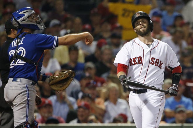 Dustin Pedroia heads to the dugout after striking out in the first inning on Tuesday night.