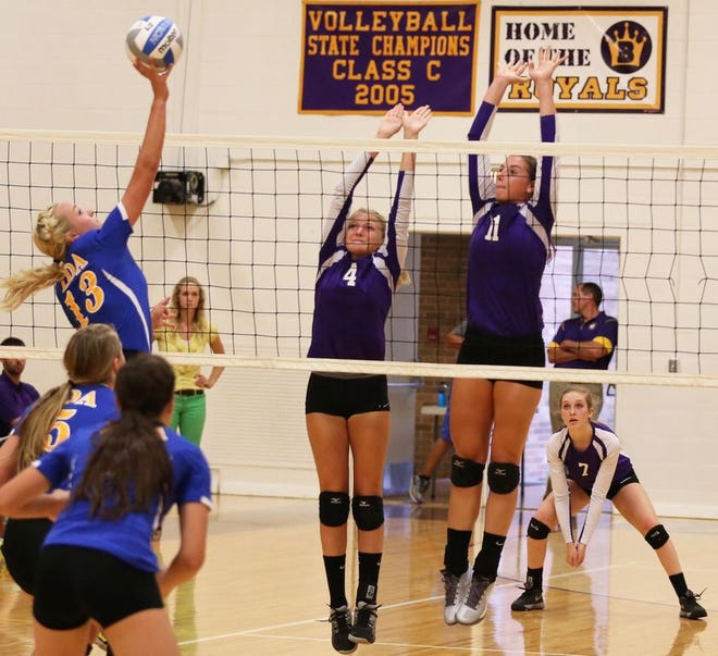 Blissfield junior Brooke Henning (11) and sophomore Jenna Andrix attempt a block Tuesday against conference-rival Ida. Blissfield won the match in five sets 25-18, 16-25, 25-19, 21-25, 15-10. Telegram Photo by Mike Dickie