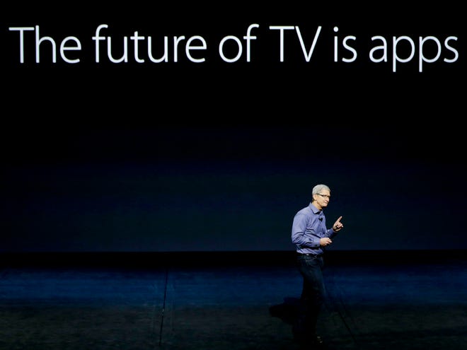 Apple CEO Tim Cook discusses the Apple TV product at the Apple event in the Bill Graham Civic Auditorium in San Francisco Wednesday.