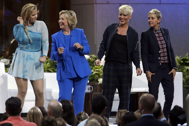 From left, actor Amy Schumer, Democratic presidential candidate Hillary Rodham Clinton, musican Pink and TV host Ellen DeGeneres dance on stage Sept. 8 during a taping of "The Ellen DeGeneres Show." The Associated Press