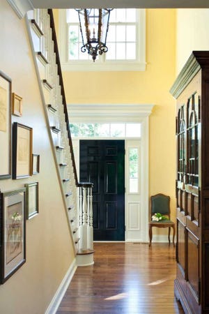 Photo by Bob Greenspan Foyer design can often be taken to the next level by extending decorative elements to a home's staircase.
