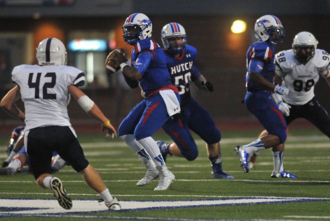 Blue Dragons quarterback Dimonic McKinzy prepares to pass to a teammate during the game in Gowans Stadium on August 27, 2015.