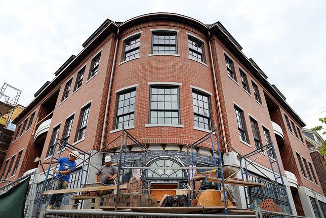 Contractors for HDC general contrators in Exeter continue brickwork on the corner of Piscataqua Landing, the former Connie Bean site in Portsmouth.

Photo by Rich Beauchesne