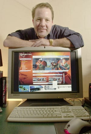 Timothy Munro Roberts posed with a Phantom gaming console in 2003. His Infinium Labs company was based on Longboat Key at the time.