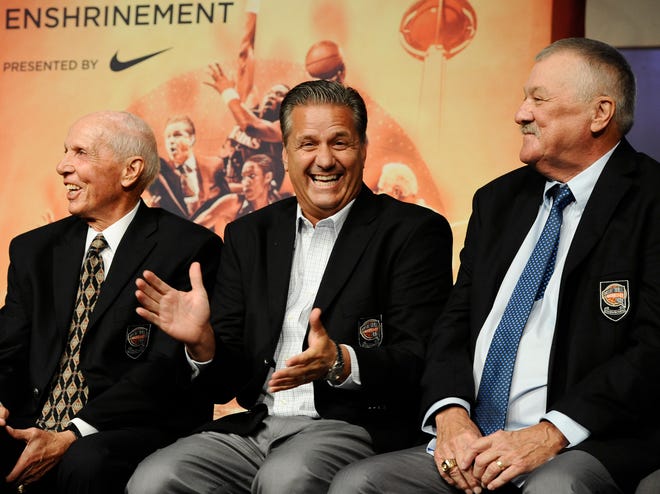 The 2015 class of inductee John Calipari, center, reacts as fellow inductees Dick Bavetta, left, and Louis Dampier, right, listen, during a news conference at the Naismith Memorial Basketball Hall of Fame,Thursday, Sept. 10, 2015, in Springfield, Mass.