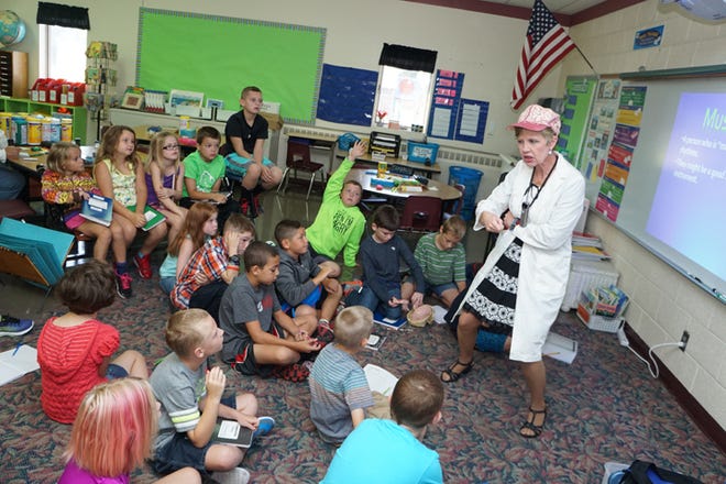Julie Ross of Siena Heights University teaches Clinton Elementary School third graders about the Eight Types of Smart on Thursday morning.
