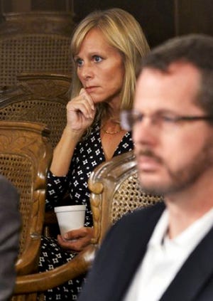 Republican state Reps. Cindy Gamrat, left, and Todd Courser listen Thursday, Sept. 10, 2015 in Lansing. Courser resigned under pressure early Friday morning, and an hour later the House expelled Gamrat in the wake of an affair and coverup by the pair.