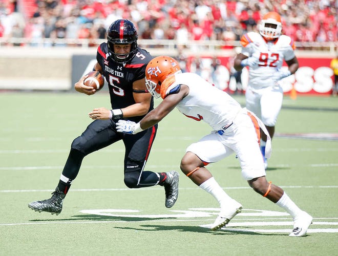 Patrick Mahomes II runs the ball in the first quarter. Texas Tech played Sam Houston State in Jones AT&T Stadium Saturday, September 5, 2015. (Allison Terry/AJ Media)