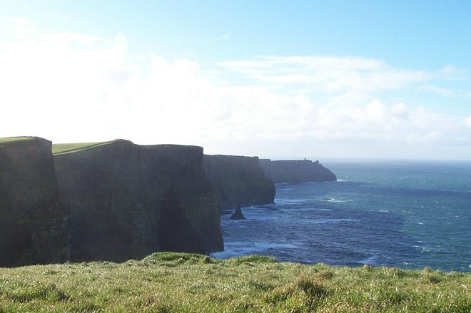 The Cliffs of Moher stretch for 8 kilometers (5 miles) along the Atlantic coast of County Clare in the west of Ireland. The majestic rock formation rises 700 feet from the sea. On a clear day, if you stand on your toes, you can see Boston from here.