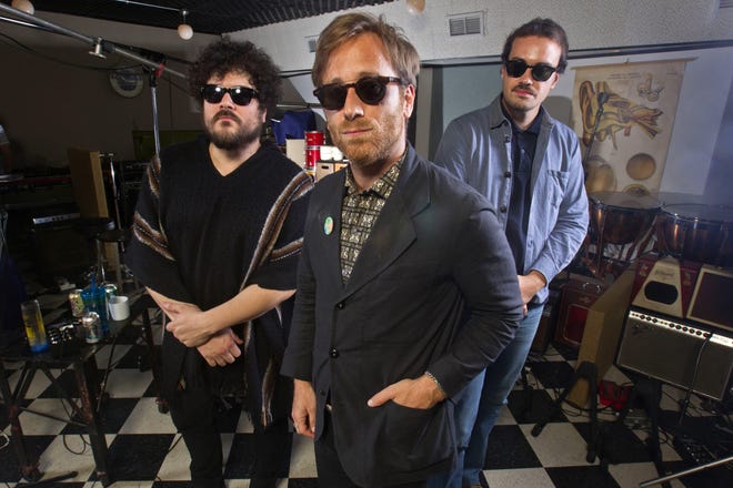 Dan Auerbach, center, Richard Swift, left, and Leon Michels at Easy Eye Studio in Nashville, Tenn. Black Keys guitarist and singer Dan Auerbach brought together studio musicians with diverse backgrounds in rock, soul, Latin and country for his new band, The Arcs. (Wade Payne/Invision/AP)