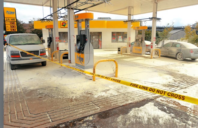 Fire retardant foam covers cars and the pavement at the Al Prime gas station, 81 Summer St. T&G Staff Photo/Steve Lanava