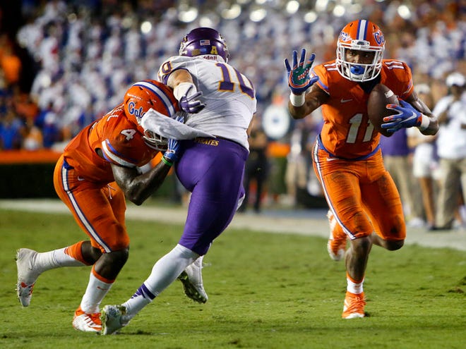 Florida Gators wide receiver Demarcus Robinson (11) runs up field after a catch against the East Carolina Pirates during the second half at Ben Hill Griffin Stadium on Saturday, Sept. 12, 2015 in Gainesville, Fla. Florida defeated the East Carolina Pirates 31-24. (Matt Stamey/Staff photographer)