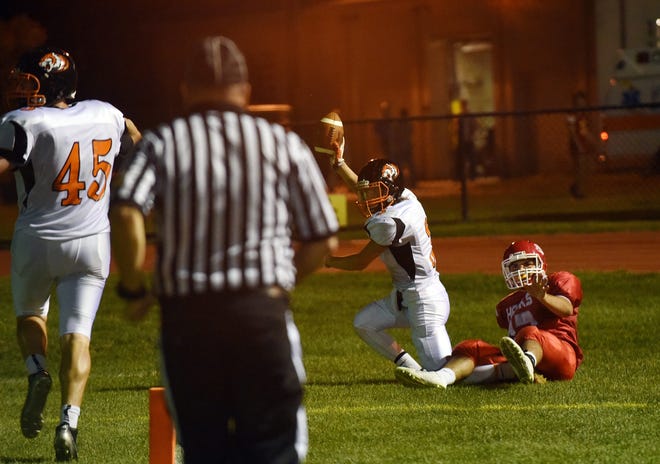 Newton North junior Bryce Adam catches a pass for a touchdown in the varsity football game against Waltham High on Friday. Wicked Local Staff Photo/Kate Flock