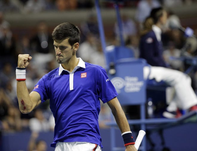 Novak Djokovic celebrates after winning a point during the men's singles finals at the U.S. Open on Sunday night. Djokovic beat Roger Federer in four sets to claim his second U.S. Open and 10th major title.