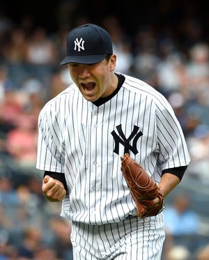 New York's Masahiro Tanaka reacts during the Yankees' 5-0 win over the Blue Jays on Sunday. THE ASSOCIATED PRESS