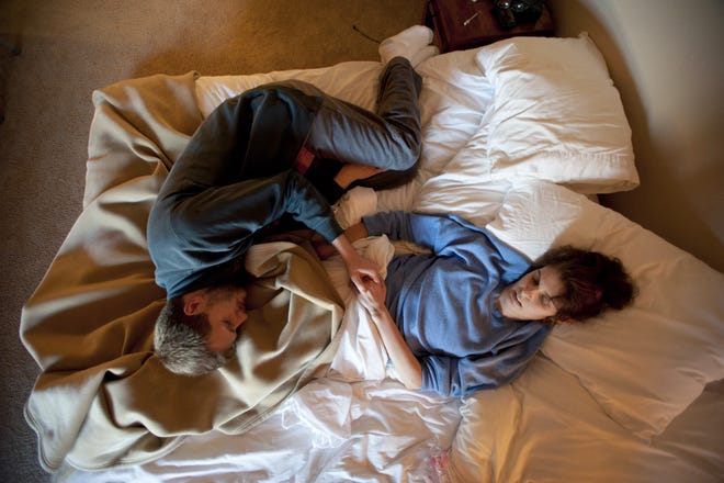 Josh Schisler and Kim Suozzi during the last days of her life, spent at an apartment in Scottsdale, Ariz., Jan. 16, 2013. Cancer claimed Suozzi at age 23, but she chose to have her brain preserved with the dream that neuroscience might one day revive her. The New York Times
