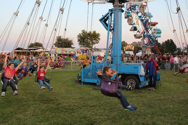 Friendship Festival goers enjoy the midway rides during last year’s Friendship Festival in Canton. The 2015 Friendship Festival begins Wednesday and promises fun for the whole family including a lip sync contest, rides, games and a parade.