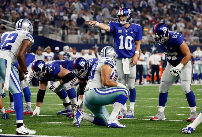 Giants' Eli Manning (10) admittedly made two crucial mistakes in a 27-26 loss to the Cowboys on Sunday. The Associated Press
