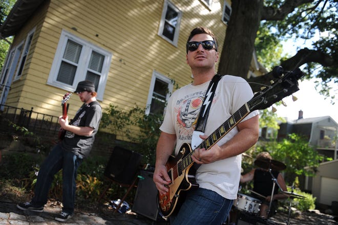 "Johnny Lightning" performs with the band the JC Trio, during Roslindale's inaugural Porch Fest event, Saturday, Sept. 12, 2015.

Wicked Local staff photo / Kate Flock