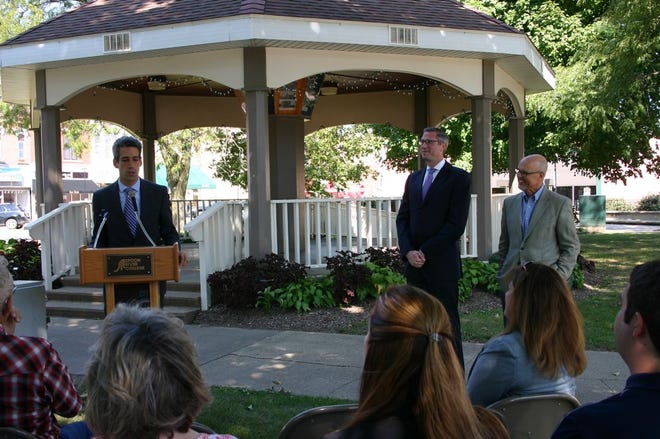 State Sen. Daniel Biss (D-Evanston), left, speaks to a crowd at Jones Park in Canton Monday afternoon. Biss, along with Illinois Treasurer Michael Frerichs, center, and State Sen. Dave Koehler (D-Peoria), right, spoke to residents about the Secure Choice Savings program. The Secure Choice Savings program allows those without access to retirement savings plans through their jobs to automatically save for retirement.