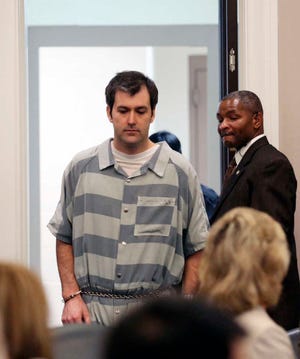 Former North Charleston police office Michael Slager, is lead into court, Thursday, Sept. 10, 2015 in Charleston, S.C. A judge reached no decision Thursday on whether to grant bail for Slager, a white former police officer charged with killing an unarmed black man following a traffic stop in coastal South Carolina. (Grace Beahm/The Post And Courier via AP) MANDATORY CREDIT