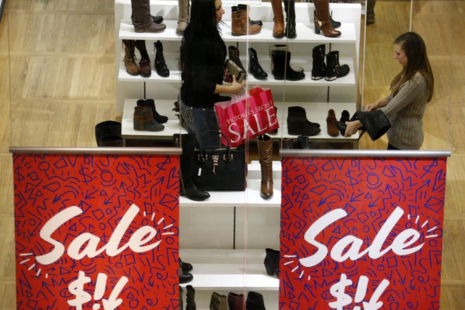Shoppers check out a sale at an ALDO store in Robinson Township, Pa. File Photo/The Associated Press