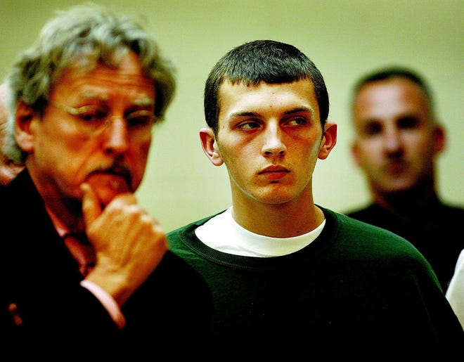 Donald Rudolph, 18, stands in Quincy District Court facing three counts of murder on Monday Nov. 14, 2011. His lawyer at left is John Darrell. Patriot Ledger file photo/ Greg Derr