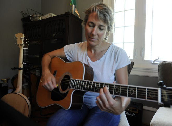 Heidi Winzinger, at her Mount Holly home, is a singer/songwriter with several CDs to her credit.