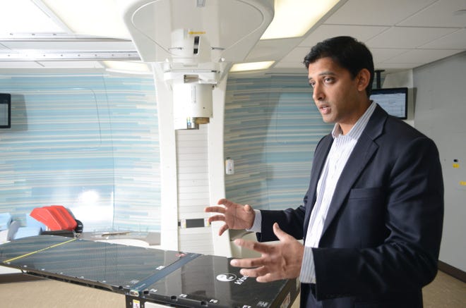 Atif Khan, MD Radiation Oncologist at Laurie Proton Therapy Treatment Center speaks about some of the equipment used to treat cancer patients Wednesday September 16, 2015 in New Brunswick, New Jersey. (Photo by William Thomas Cain)