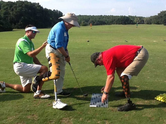 Courtesy of Terry Bergeron A golfer with a prosthesis demonstrates Adaptive Golf.