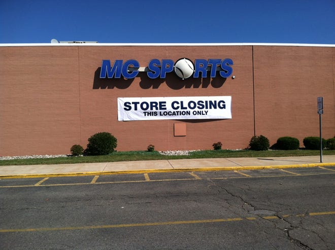 A large “Store Closing” banner is seen hanging on the MC Sports location at the Adrian Mall.