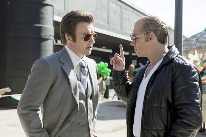 Joel Edgerton portrays John Connolly, left, and Johnny Depp portrays Whitey Bulger in "Black Mass."