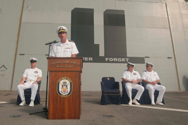 Commanding Officer Capt. Kenneth Coleman, from Vestal, N.Y., address the crew and guests during a 9/11 memorial service aboard the amphibious transport dock ship USS New York (LPD 21). New York is currently conducting a maintenance period.