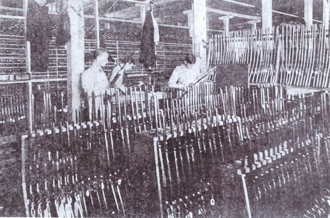 Photo courtesy of Carl Saporito, of New Hartford
Inspection time at Savage Arms
The inspection room at Savage Arms in Utica was a busy place in 1912 with firearms experts
testing finished rifles for possible defects. The company was founded in 1895 when Arthur W.
Savage, working in his cellar on Howard Avenue, invented an improved repeating rifle. He
began to manufacture the '99 Savage in a small room on Burchard Lane in downtown Utica. He
later moved into a building at Broad and Hubbell streets and then, in 1909, the company built a
large factory on Turner Street on the city's eastern boundary. In 1955, Sperry Rand bought the
building and occupied it until 1977. Charles Gaetano then bought the building and established
CharlesTown there, a complex of factory outlet stores.
