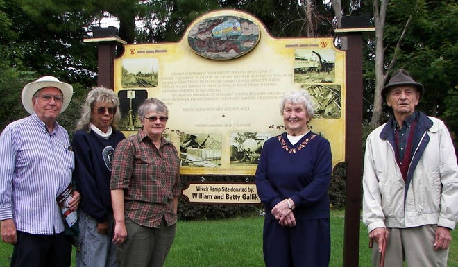 As part of last year’s Great Chocolate Festival, a plaque at the actual site of the 1955 train wreck was unveiled to honor residents Betty and Bill Gallik for their donation of the land to the Chocolate Train Wreck Foundation. Pictured at the unveiling are, from left, Art Zimmer, originator of the foundation; Joan Prindle, chair of the Hamilton Historical Commission; Margaret Miller, then-mayor of Hamilton; and Betty and Bill Gallik.