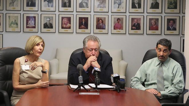 (L-R) West Palm Beach Mayor Jeri Muoio, City Administrator Jeff Green and city spokesman Elliot Cohen hold a news conference Tuesday afternoon, Sept. 15, 2015, to respond to city’s posting of confidential police records on the city’s Web site. (Damon Higgins / The Palm Beach Post)