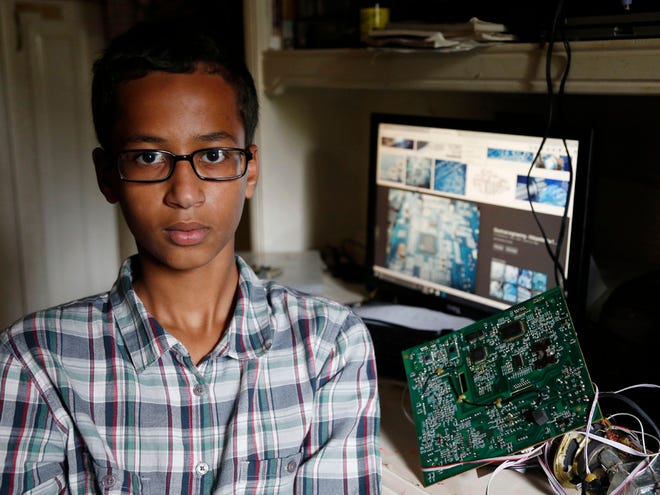 Irving MacArthur High School student Ahmed Mohamed, 14, poses for a photo at his home in Irving, Texas on Tuesday, Sept. 15, 2015. Mohamed was arrested and interrogated by Irving Police officers on Monday after bringing a homemade clock to school. Police don't believe the device is dangerous, but say it could be mistaken for a fake explosive. He was suspended from school for three days, but he has not been charged.
