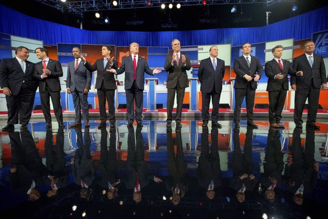 FILE - In this Aug. 6, 2015, file photo, Republican presidential candidates from left, Chris Christie, Marco Rubio, Ben Carson, Scott Walker, Donald Trump, Jeb Bush, Mike Huckabee, Ted Cruz, Rand Paul, and John Kasich take the stage for the first Republican presidential debate in Cleveland. Eleven top-tier Republican presidential hopefuls face off in their second prime-time debate of the 2016 campaign Sept. 16, in a clash between outsiders and establishment candidates under a cathedral of political conservatism. (AP Photo/Andrew Harnik, File)