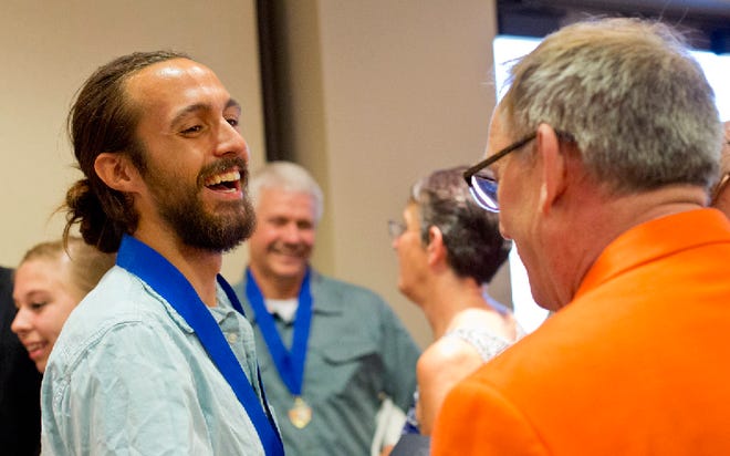 Zebulon Boeskool talks with people after a Lifesaving Awards Ceremony Sept. 2 at the Community Center in Grand Haven.