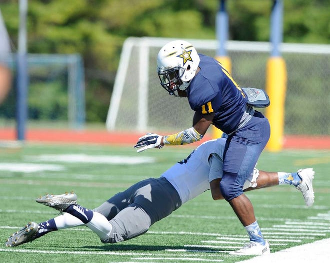 Siena Heights University wide receiver Curtis Smith Jr. (11) 
completes a catch during his team’s 42-35 victory over Missouri Baptist. Smith and the Saints have seen multiple players contribute to their early 2-0 start, including quarterbacks Nick Gilliam and Lucas Barner Jr. Telegram File Photo by Bashar Alshabi