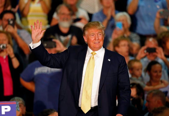 Republican presidential candidate Donald Trump acknowledges applause at a town hall event Thursday, Sept. 17, 2015, in Rochester, N.H. (AP Photo/Robert F. Bukaty)