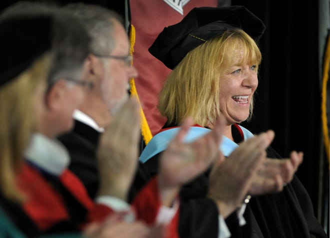 A smiling Mary Louise Retelle acknowledges applause as Anna Maria College's 11th president during the presidential Inauguration ceremony at the college on Friday. T&G Staff/Paul Kapteyn
