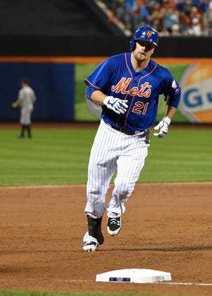 Mets first baseman Lucas Duda rounds the bases after hitting a solo home run off of Yankees starting pitcher Masahiro Tanaka in the second inning Friday night at Citi Field. It was Duda's first homer since Aug. 2. Daniel Murphy and Juan Uribe also slugged home runs in the Mets' win over their crosstown rivals. The Associated Press