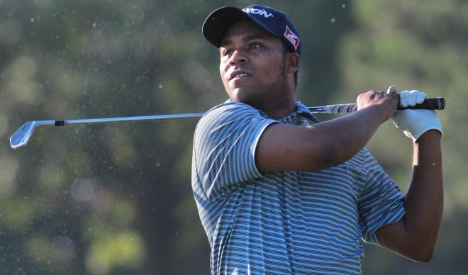Harold Varner III, who graduated from Forestview High in 2008, takes his second shot on the second hole during the Small Business Connection Championship’s first round at River Run Country Club in Davidson on Thursday. Varner will begin the final round today at 9-under par.