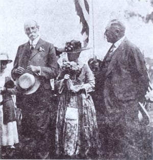 Maria and Thomas Proctor (on the left) donated a Trophy Cup to the Utica Golf and Country Club in New York Mills (today Twin Ponds) in July 1917 that was to be given to the winner of a club tournament later in the week. At right is Arthur Hind, president of the club. (Five years later, Hind would own the most valuable stamp in the world, the one-cent 1856 British Guiana.)
The Proctors were greeted by 30 caddies - each waving a small American flag -- lined along the long shady drive to the clubhouse. Thomas Proctor told the crowed gathered there that he regretted he did not play golf and added: "But I do have a sport and it is parks." In 1908, Maria and Thomas gave Utica its magnificent parks system.