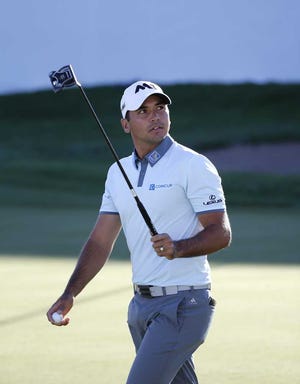 Jason Day acknowledges the crowd after making birdie on the 18th hole during the third round of the BMW Championship on Saturday at Conway Farms Golf Club in Lake Forest, Ill. (AP Photo/Charles Rex Arbogast)